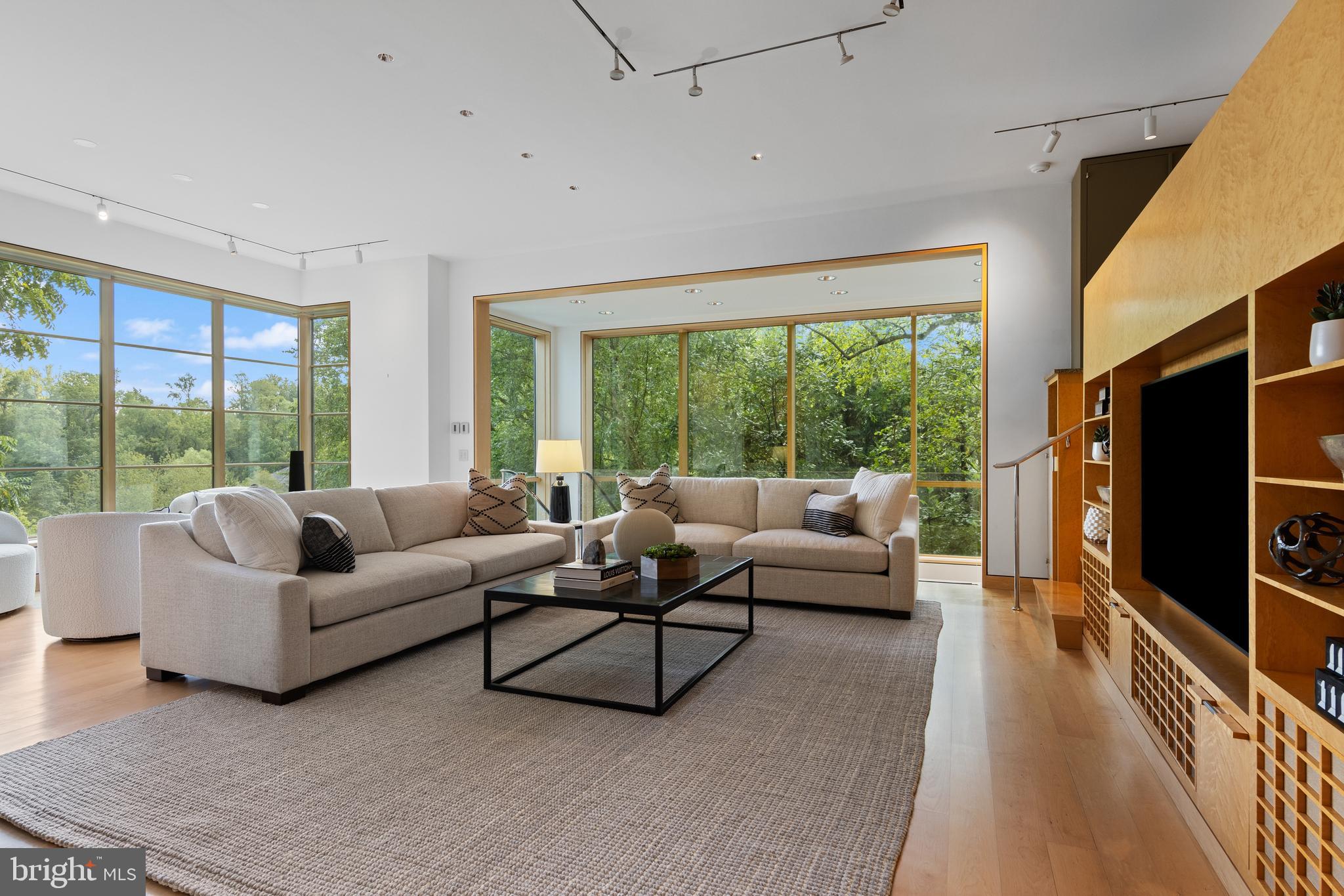 308-310 Julip Run Wayne, PA 19087 - Photo 37 of 127 a living room with furniture tv and a large window