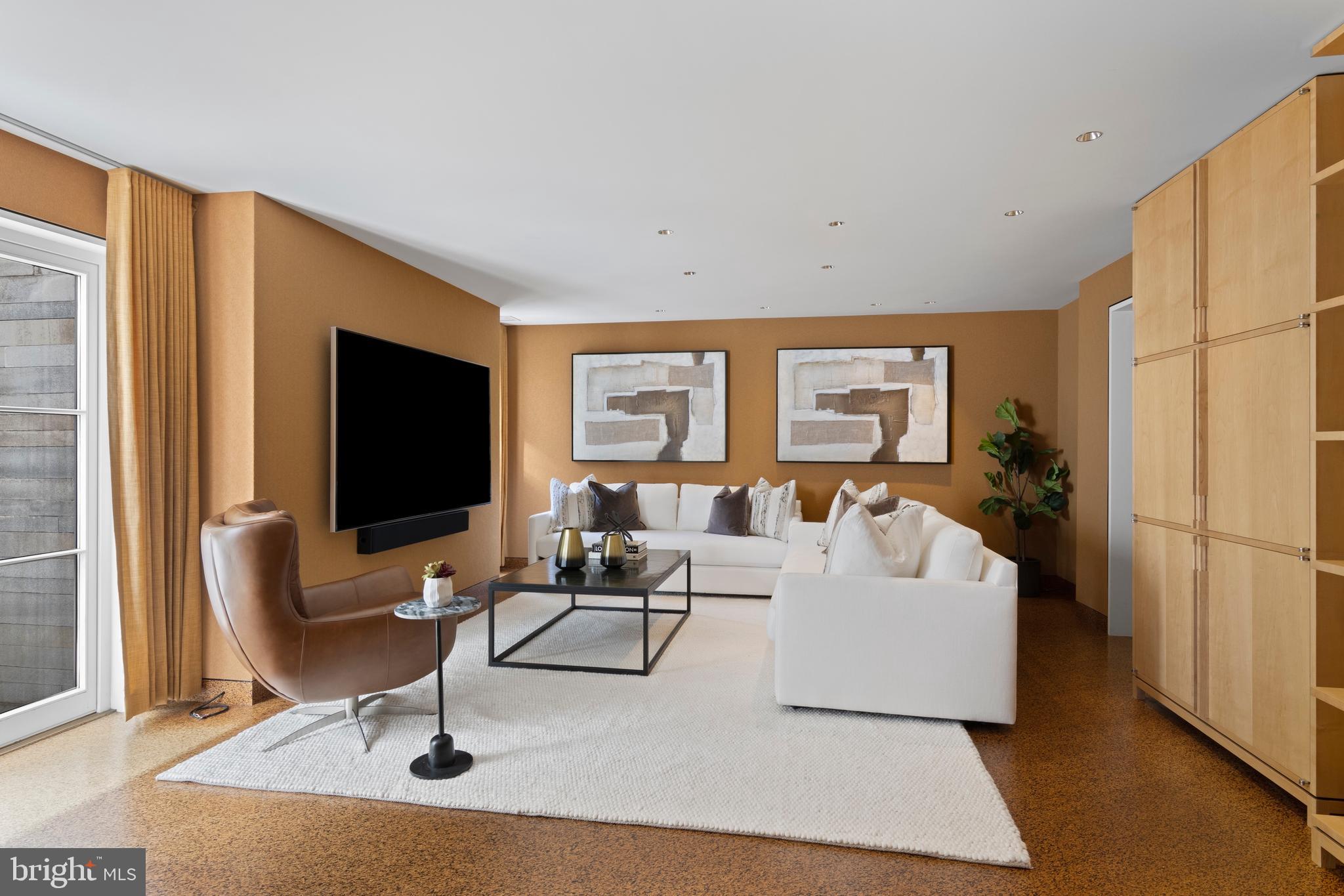 308-310 Julip Run Wayne, PA 19087 - Photo 68 of 127 a living room with furniture a flat screen tv and a large window