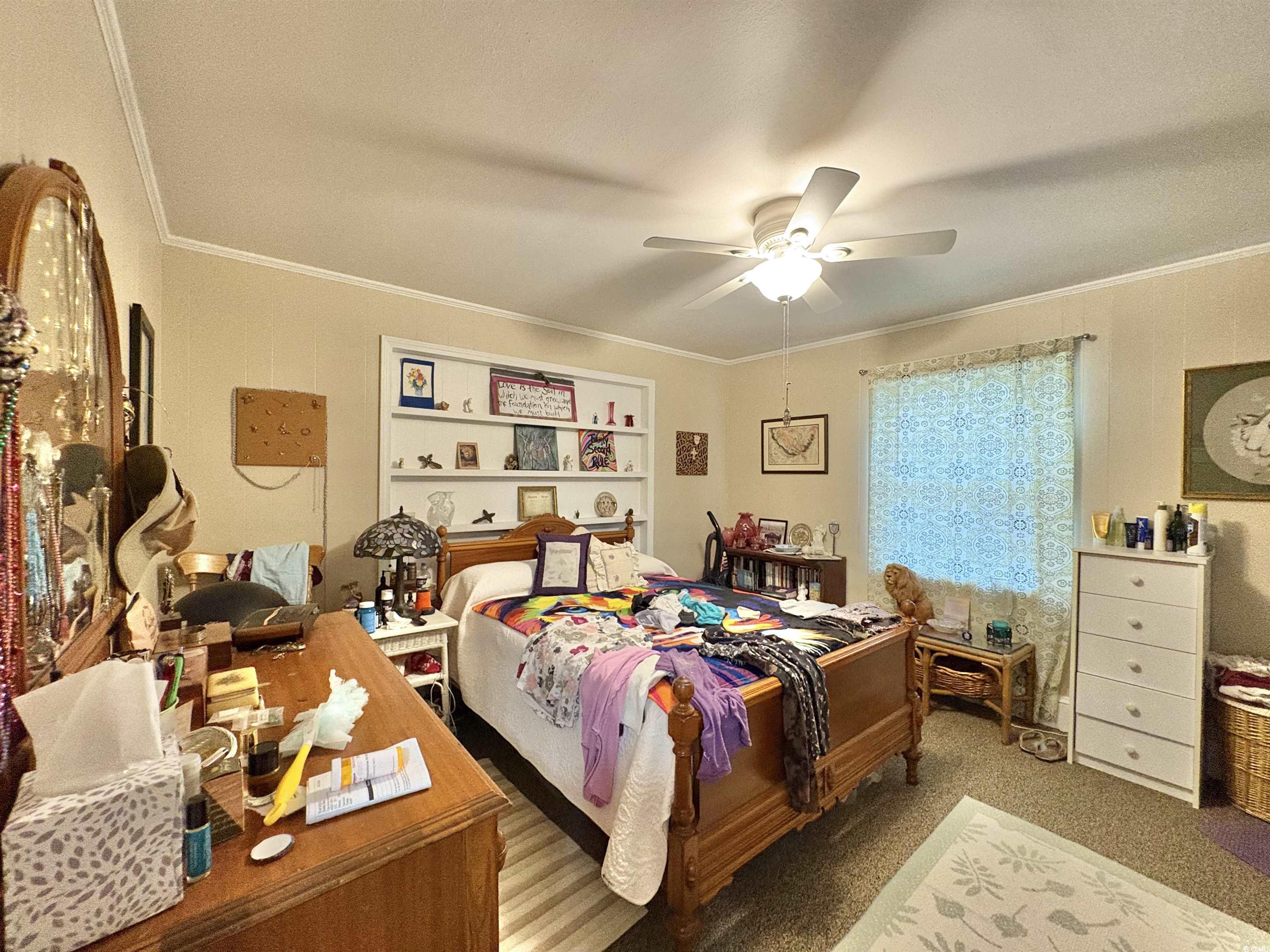 520-526 Boundary Avenue Murrells Inlet, SC 29576 - Photo 17 of 38 Bedroom featuring crown molding, ceiling fan, and carpet flooring