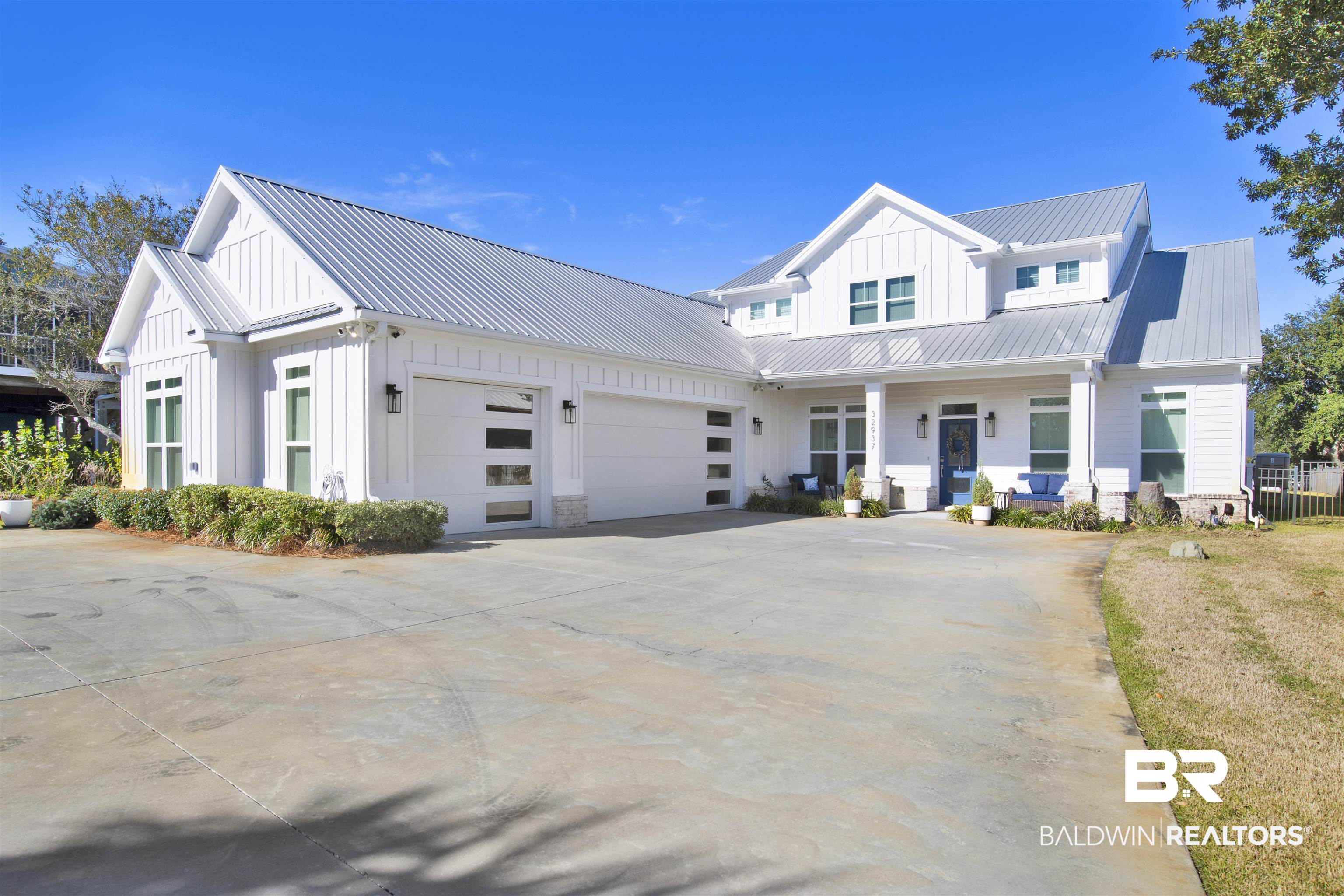 32937 River Road Orange Beach, AL 36561 - Photo 2 of 42 Modern farmhouse style home featuring a garage