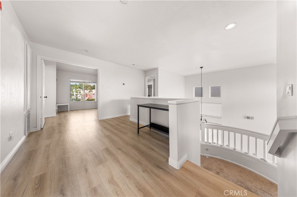 2 Cameron Circle Lake Forest, CA 92610 - Photo 12 of 45 a view of a kitchen with wooden floor and electronic appliances