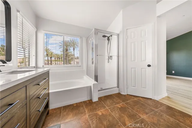 a spacious bathroom with a bathtub and a sink