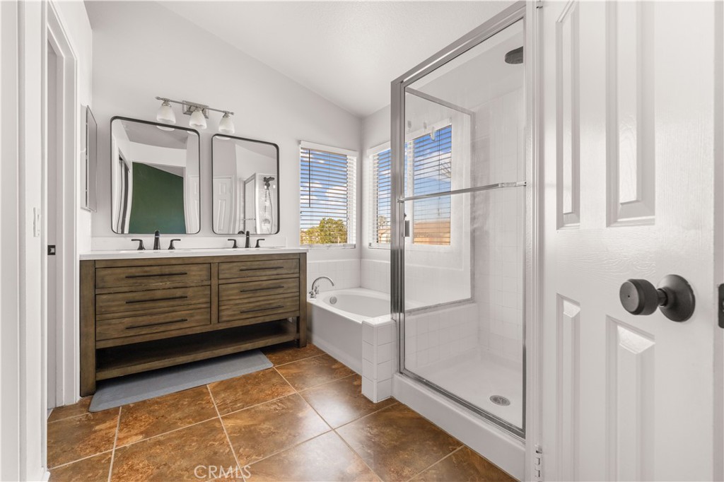 2 Cameron Circle Lake Forest, CA 92610 - Photo 18 of 45 a bathroom with a tub shower and mirror