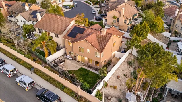 an aerial view of a residential apartment building with a yard