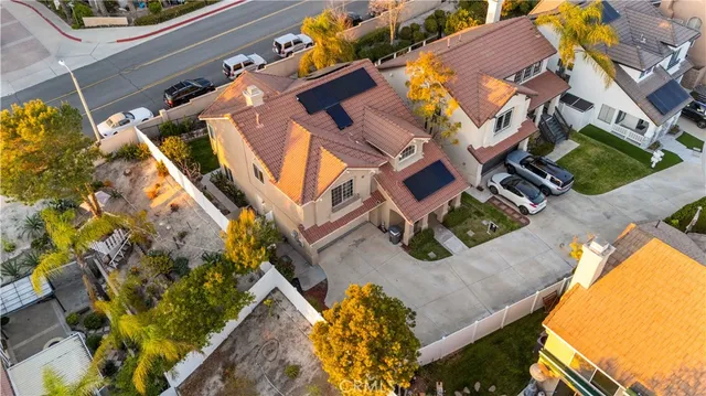 an aerial view of residential houses with yard