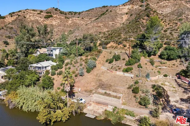 a view of a yard with a mountain