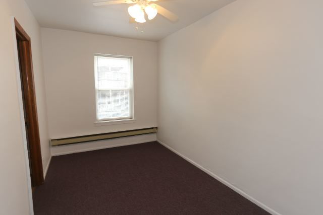 4515 North Malden Street, Unit 1C Chicago, IL 60640 - Photo 13 of 16 an empty room with a window