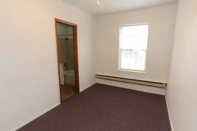 a bathroom with a toilet and a bathtub