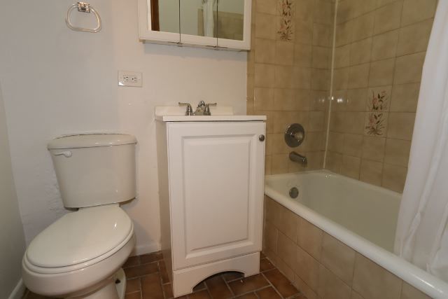 4515 North Malden Street, Unit 1C Chicago, IL 60640 - Photo 16 of 16 a bathroom with a toilet and a bathtub