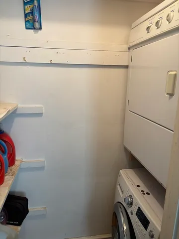 a view of storage and utility room with washer and dryer