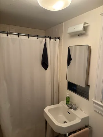 a bathroom with a sink and mirror
