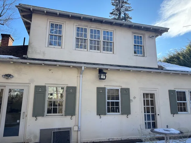 a front view of a house with a lots of windows