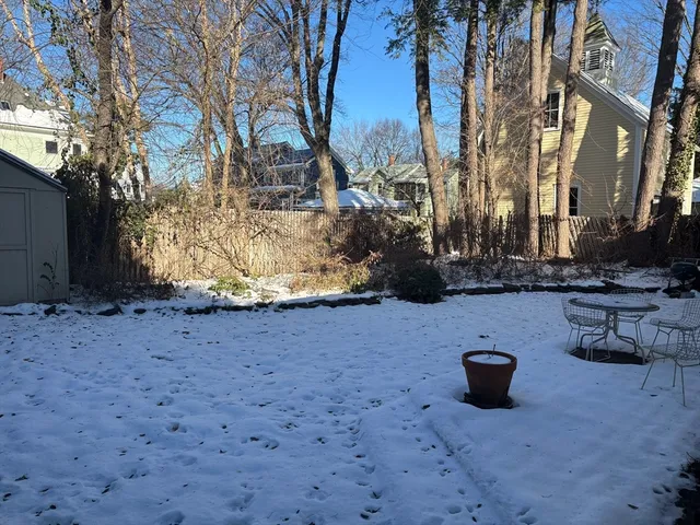 a view of a backyard of the house