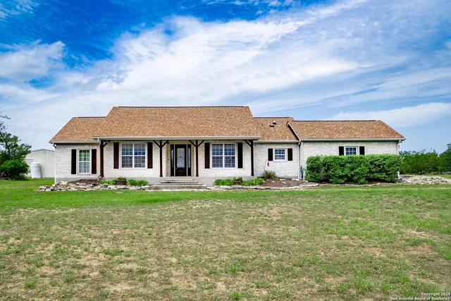 front view of a house with a yard