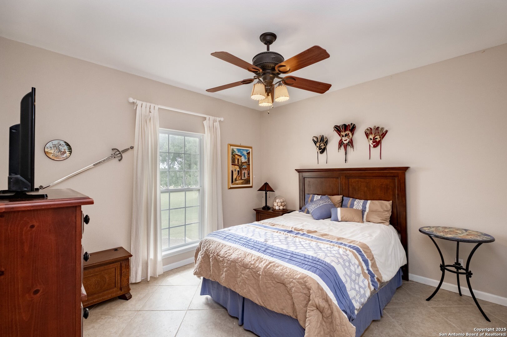 233 N Fork Bandera, TX 78003 - Photo 24 of 71 a bedroom with a bed and a chandelier