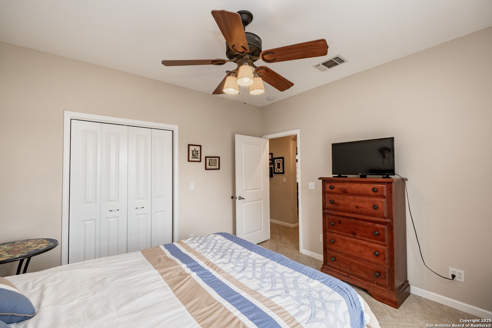 233 N Fork Bandera, TX 78003 - Photo 25 of 71 a bedroom with a bed and a flat screen tv