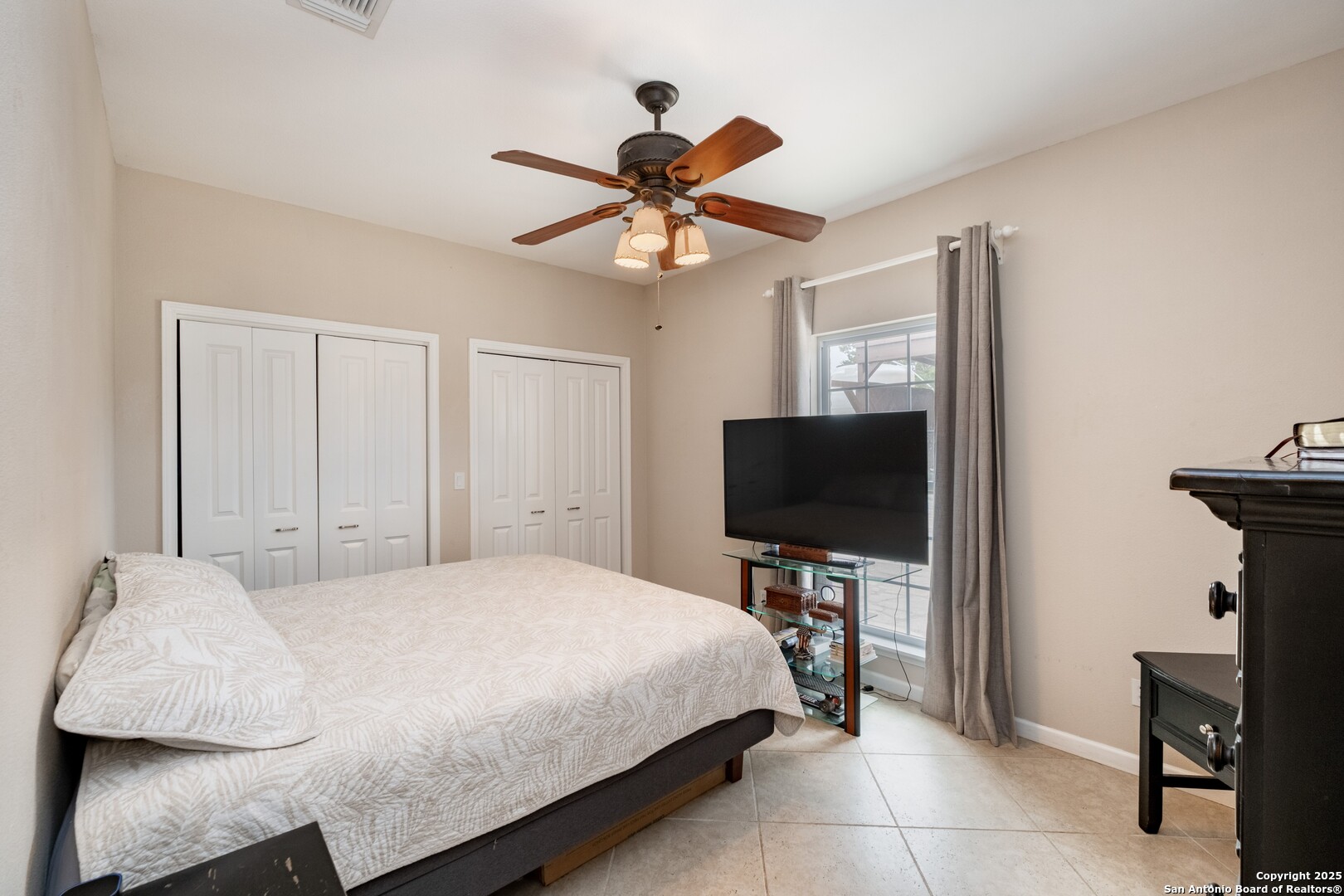 233 N Fork Bandera, TX 78003 - Photo 27 of 71 a bedroom with a bed and a flat screen tv