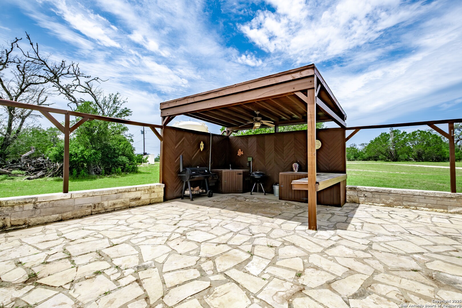233 N Fork Bandera, TX 78003 - Photo 31 of 71 a backyard of a house with basket ball table and chairs