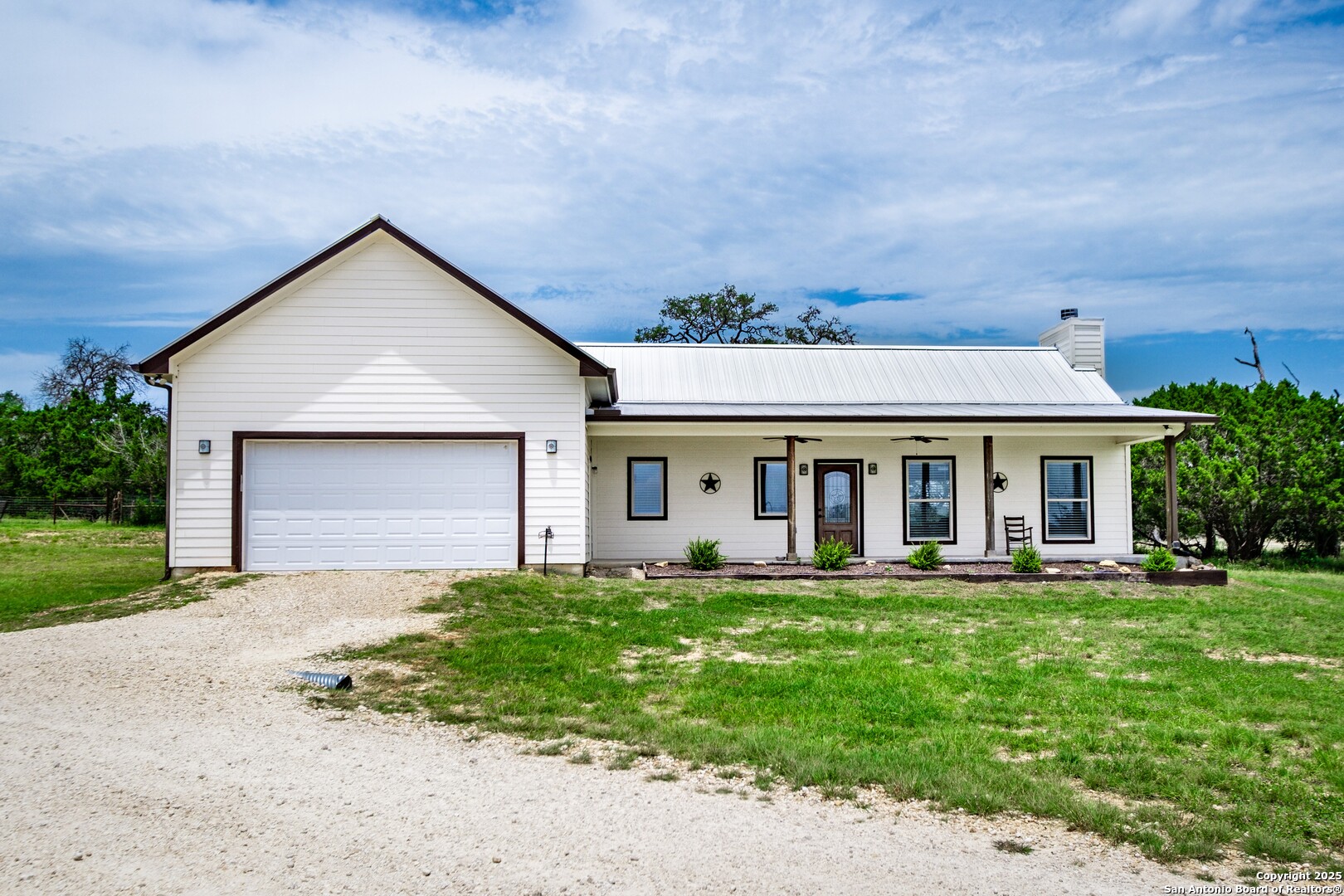 233 N Fork Bandera, TX 78003 - Photo 37 of 71 front view of a house with a yard