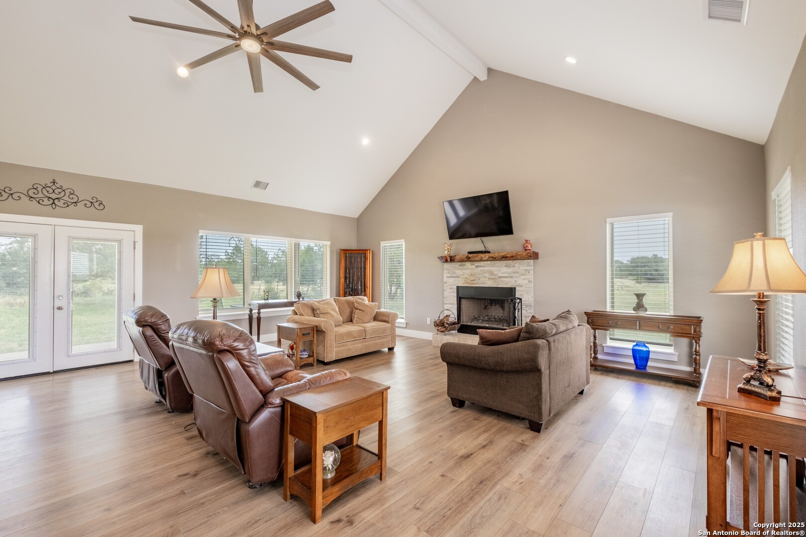 233 N Fork Bandera, TX 78003 - Photo 41 of 71 a living room with furniture fireplace and a flat screen tv