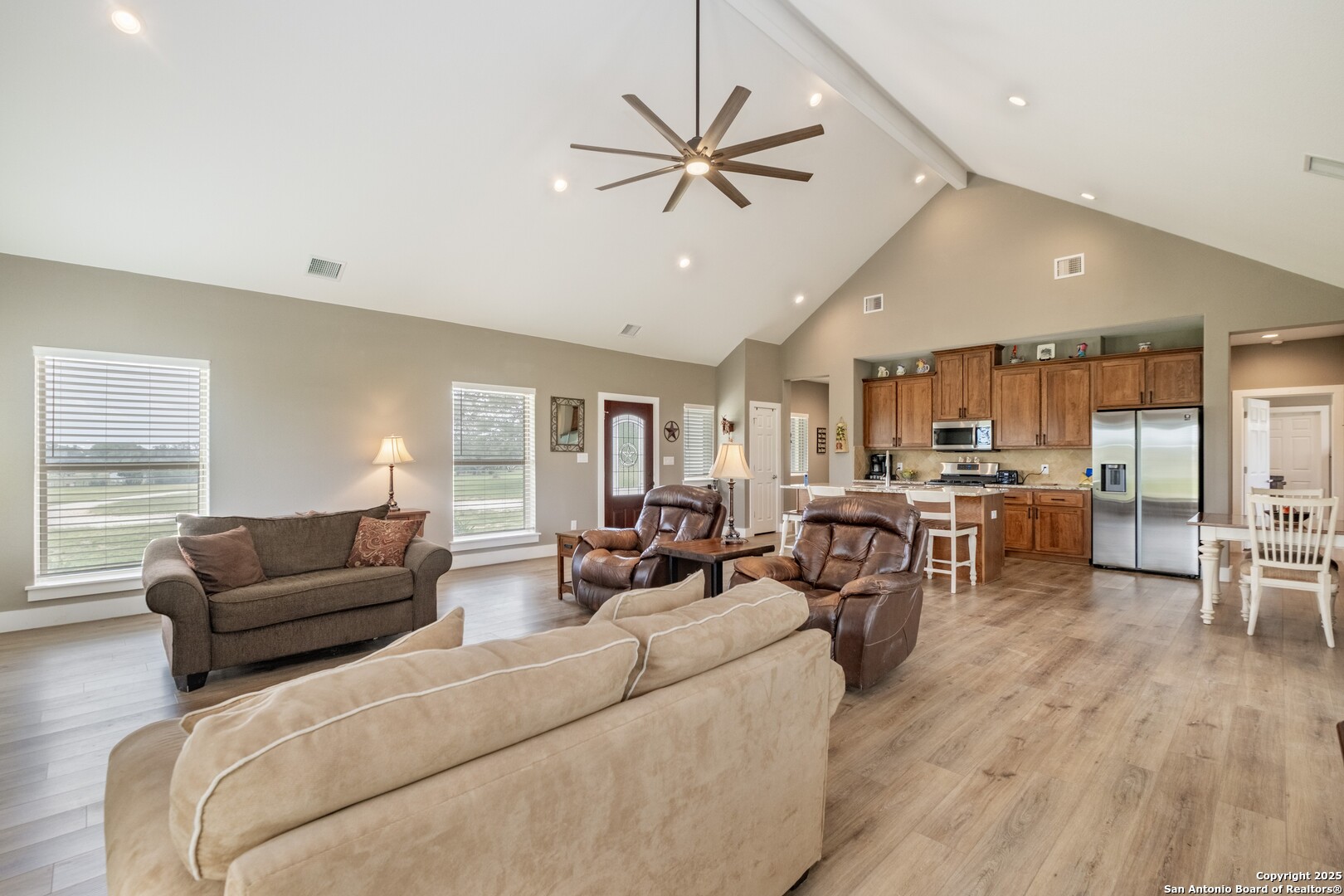 233 N Fork Bandera, TX 78003 - Photo 42 of 71 a living room with furniture kitchen area and a wooden floor