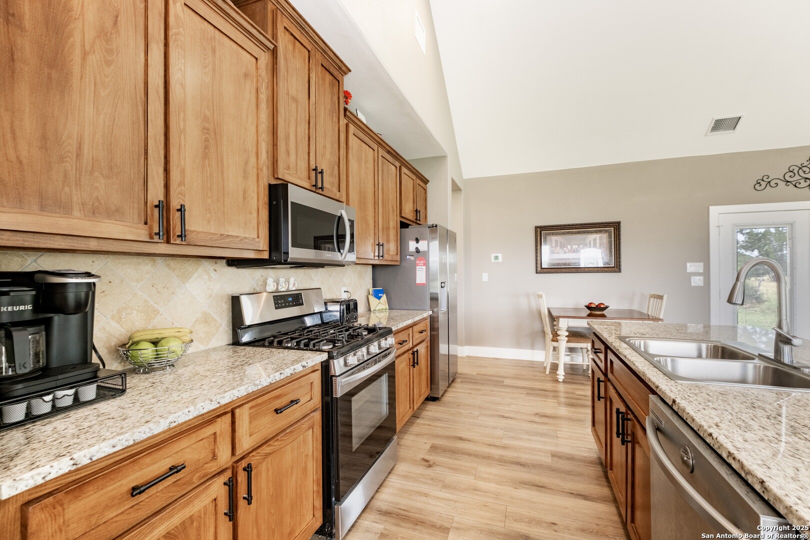 233 N Fork Bandera, TX 78003 - Photo 47 of 71 a kitchen with stainless steel appliances granite countertop a stove a sink and a microwave