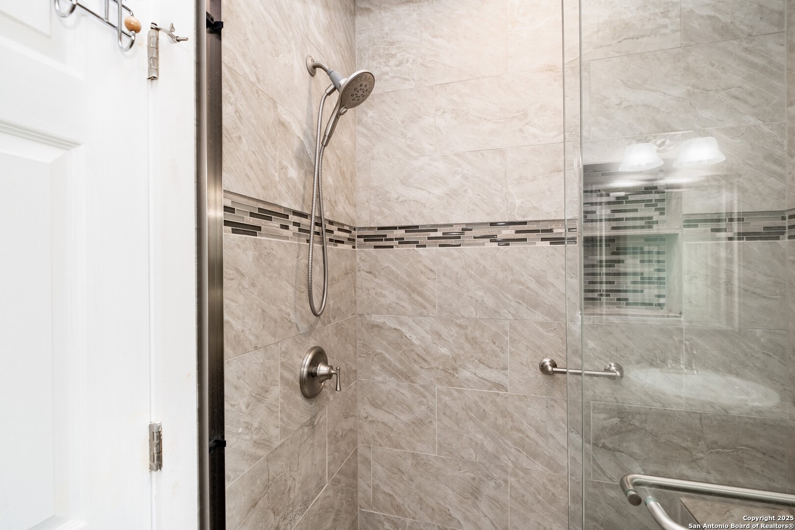 233 N Fork Bandera, TX 78003 - Photo 53 of 71 a bathroom with a glass shower door
