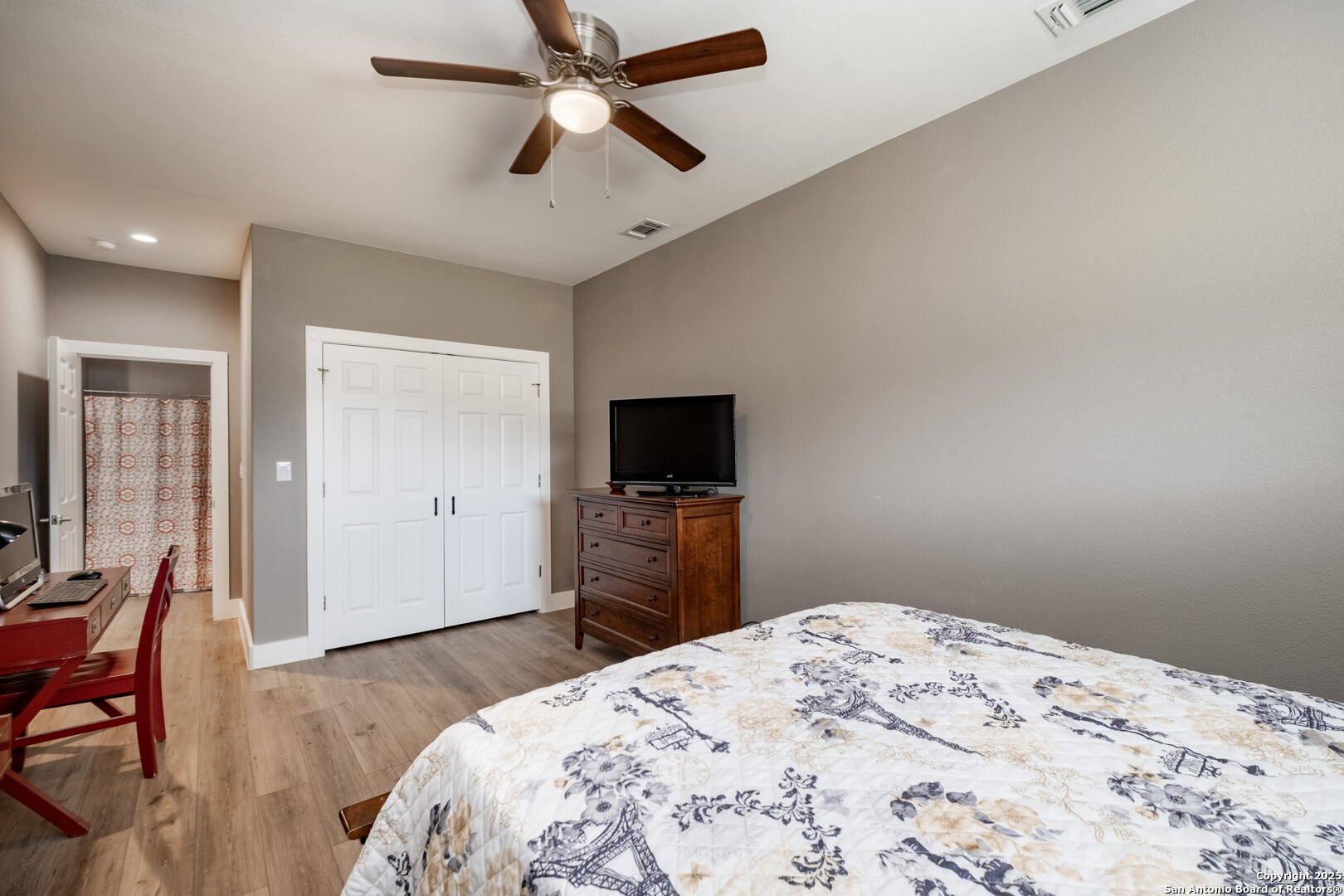 233 N Fork Bandera, TX 78003 - Photo 55 of 71 a bedroom with a bed and a flat screen tv