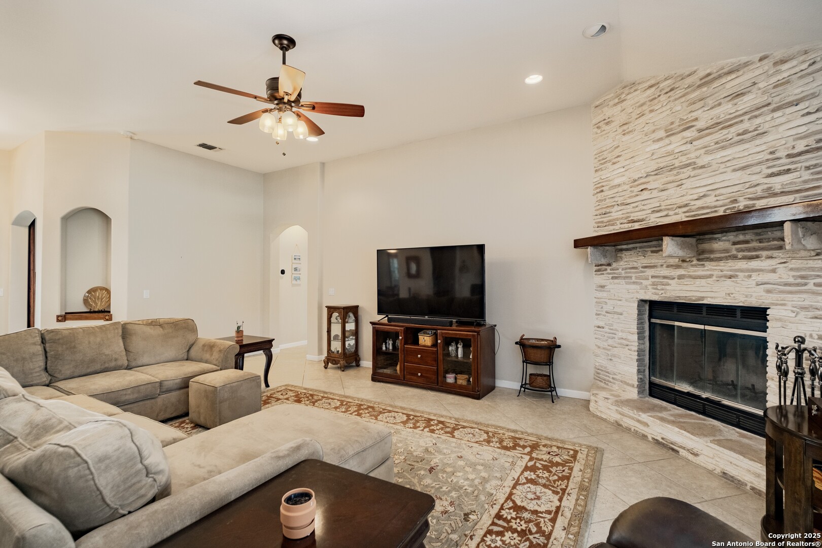 233 N Fork Bandera, TX 78003 - Photo 7 of 71 a living room with furniture and a fireplace