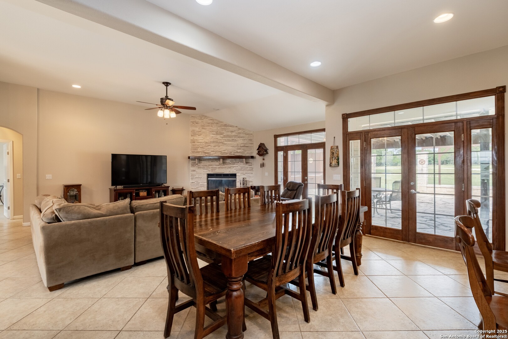 233 N Fork Bandera, TX 78003 - Photo 9 of 71 a view of a dining room with furniture and a flat screen tv
