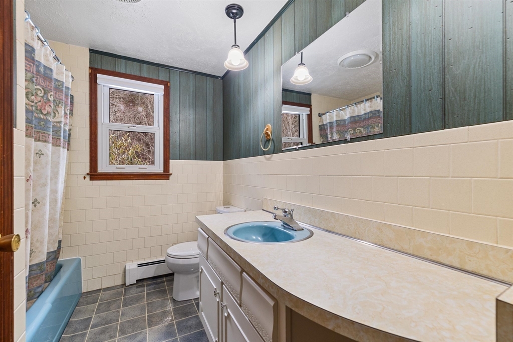 8 Cider Mill Road North Brookfield, MA 01535 - Photo 13 of 30 a bathroom with a sink a toilet and a mirror