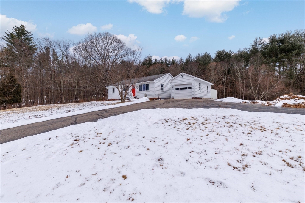 8 Cider Mill Road North Brookfield, MA 01535 - Photo 23 of 30 a view of a dry yard covered with snow in front of house