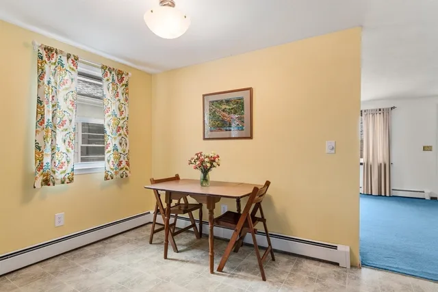 a view of a livingroom with furniture and a window