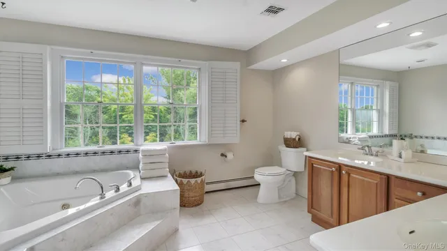 a bathroom with a toilet sink and bathtub