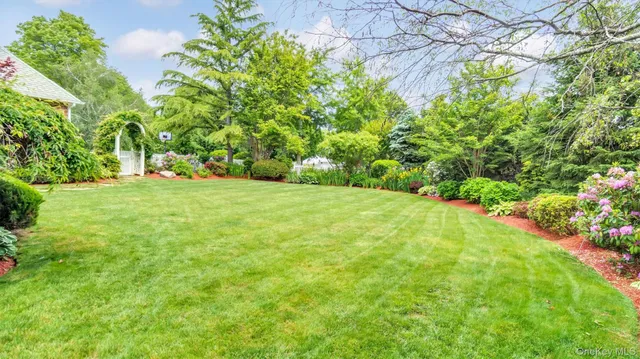 a picture of a bathroom with a sink and a mirror