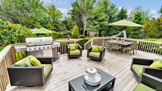 a view of a deck with furniture