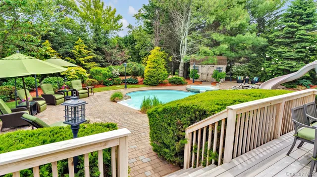 a view of a garden with deck and a garden