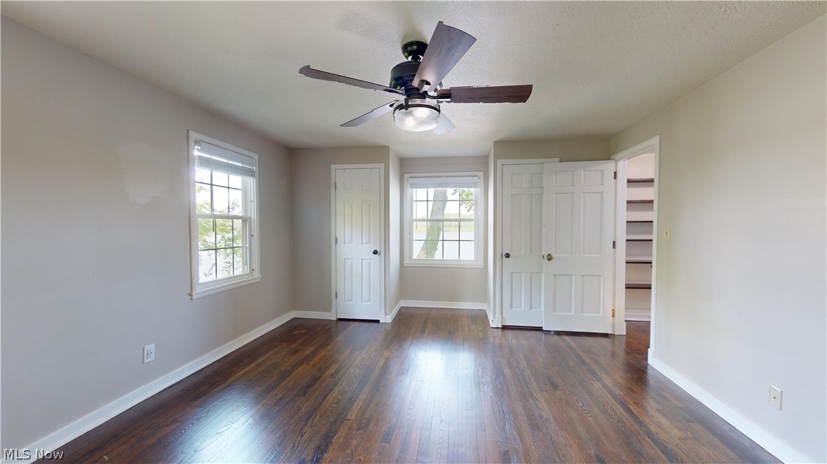 7421 Diagonal Road Kent, OH 44240 - Photo 23 of 48 Unfurnished bedroom featuring ceiling fan and dark hardwood / wood-style flooring