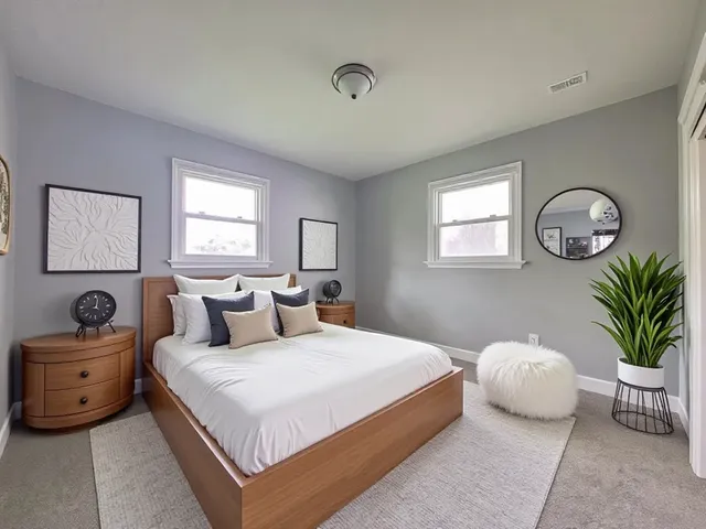 a bedroom with a bed and a couch