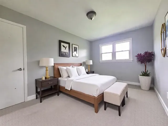a bedroom with a bed and a couch