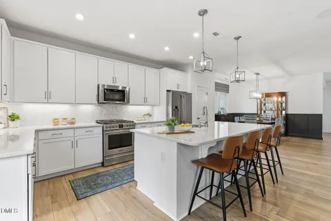 a kitchen with a sink and a refrigerator