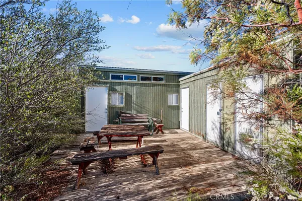 a view of a lounge chair in the backyard of a house