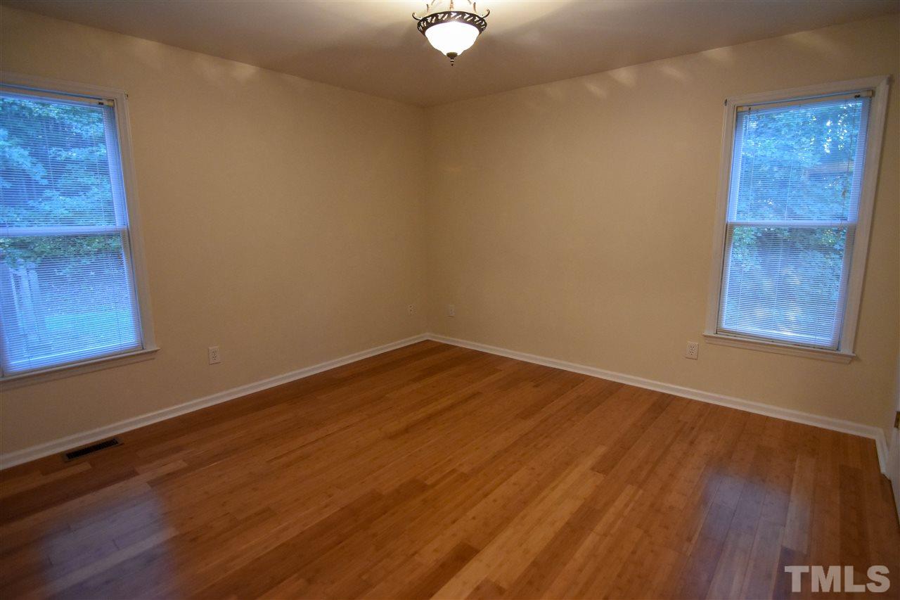 540 North Ridge Circle Roxboro, NC 27574 - Photo 11 of 21 a view of an empty room with wooden floor and a window