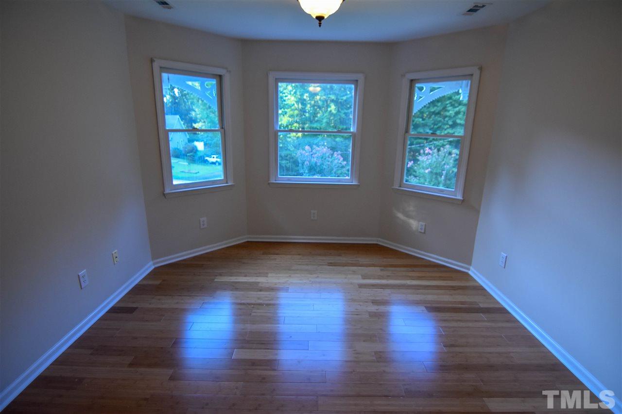 540 North Ridge Circle Roxboro, NC 27574 - Photo 13 of 21 a view of an empty room with wooden floor and a window