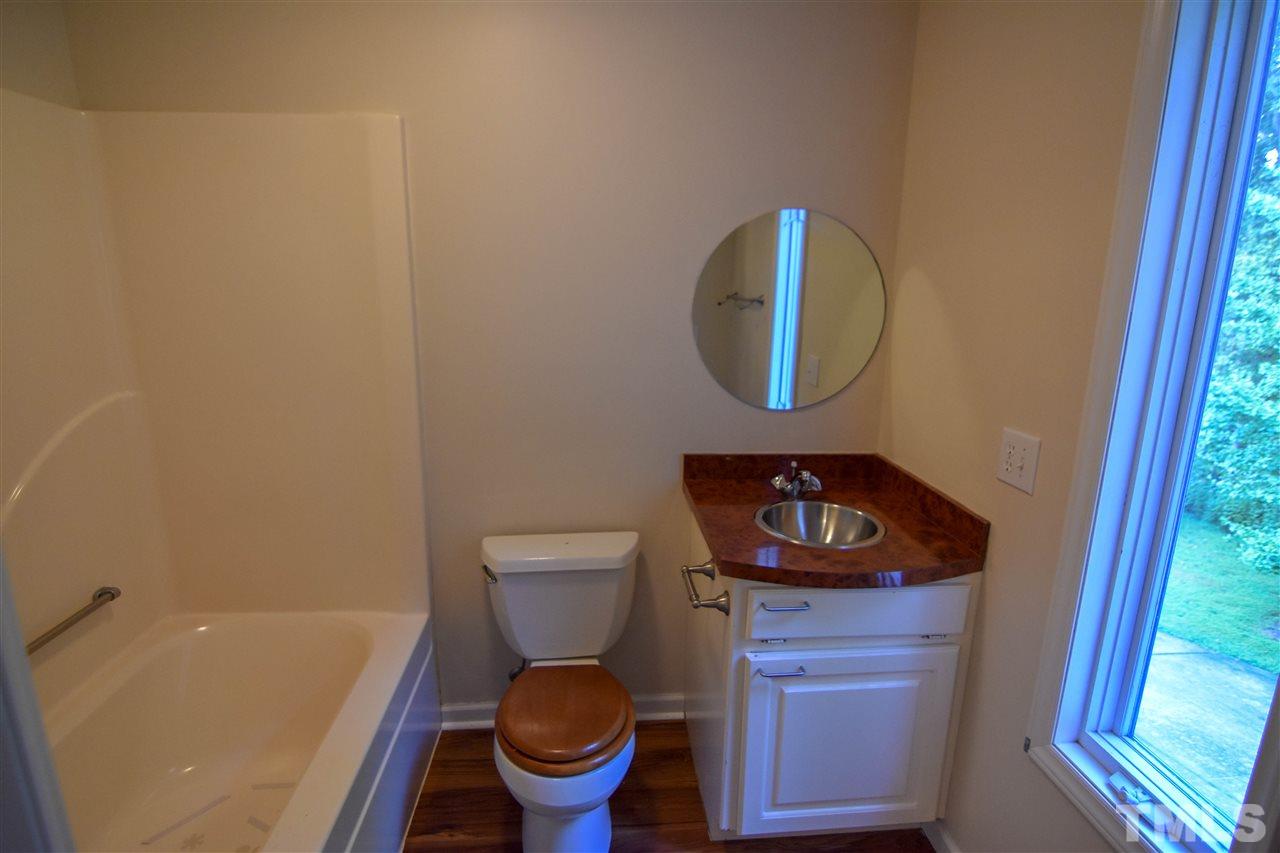 540 North Ridge Circle Roxboro, NC 27574 - Photo 17 of 21 a bathroom with a toilet and a sink