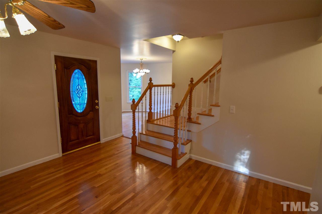 540 North Ridge Circle Roxboro, NC 27574 - Photo 3 of 21 a view of an entryway with wooden floor and a front door