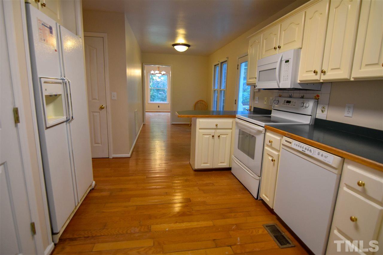 540 North Ridge Circle Roxboro, NC 27574 - Photo 4 of 21 a kitchen with stainless steel appliances a refrigerator sink and cabinets