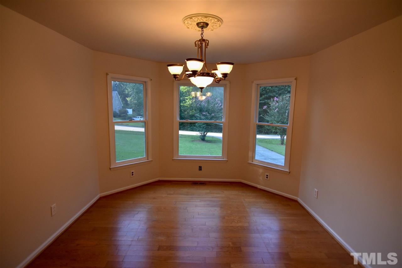 540 North Ridge Circle Roxboro, NC 27574 - Photo 5 of 21 a view of a room with wooden floor chandelier and windows