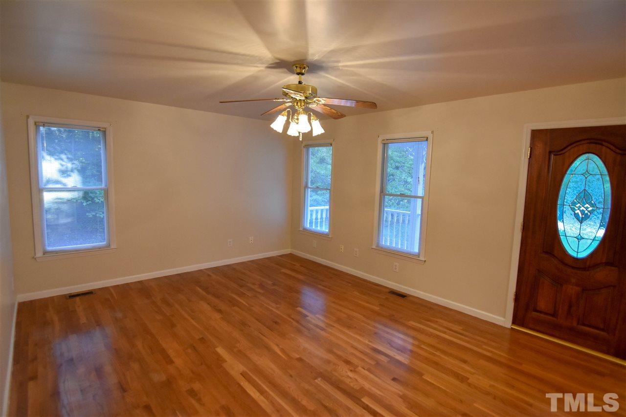 540 North Ridge Circle Roxboro, NC 27574 - Photo 10 of 21 a view of an empty room with window and wooden floor