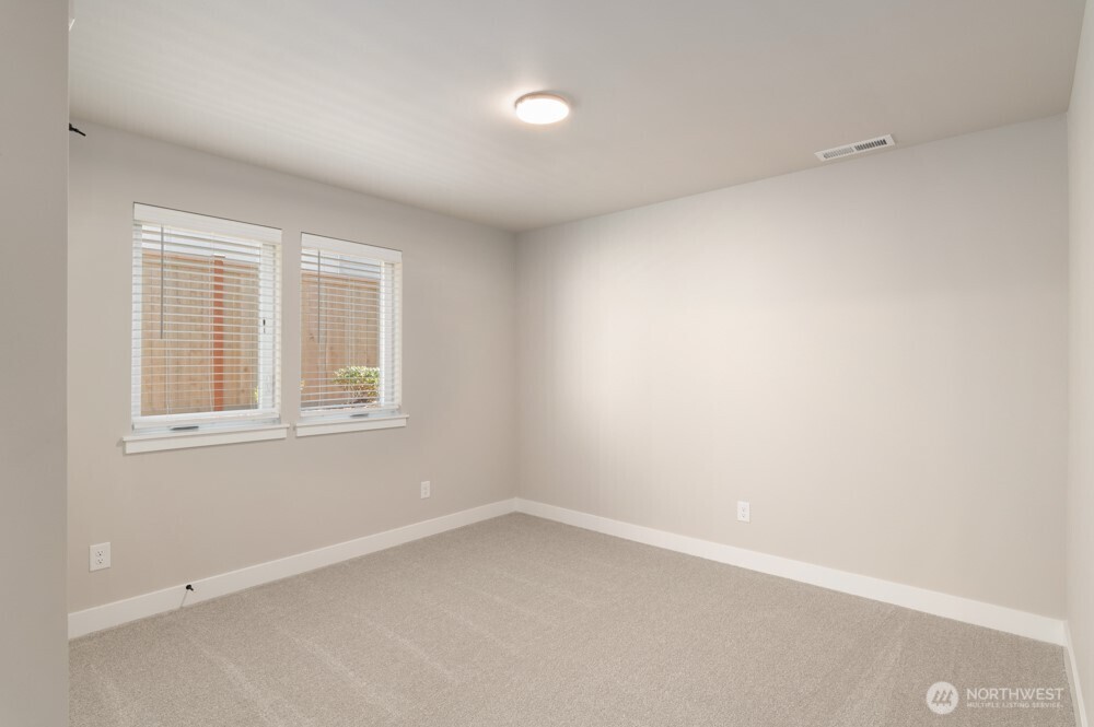 6609 South 128th Street Seattle, WA 98178 - Photo 3 of 28 an empty room with a window
